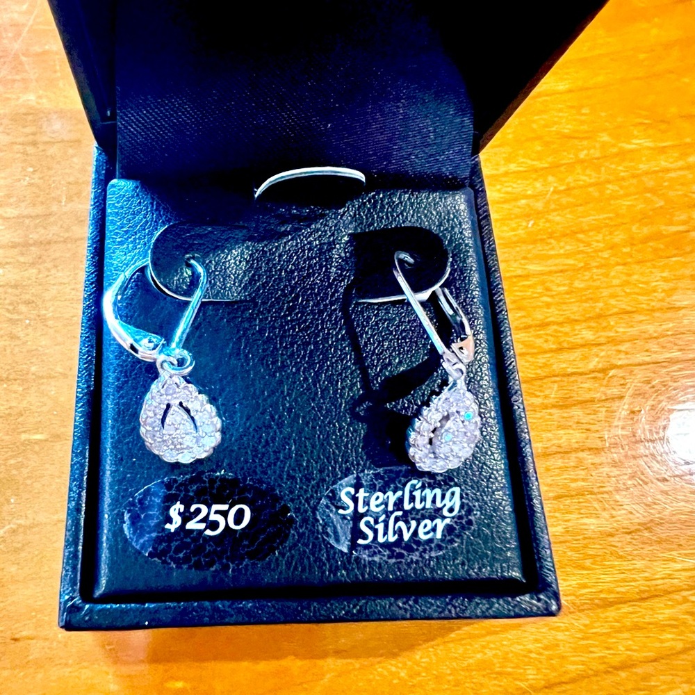 Diamond earrings set in Sterling Silver 1/4 carat